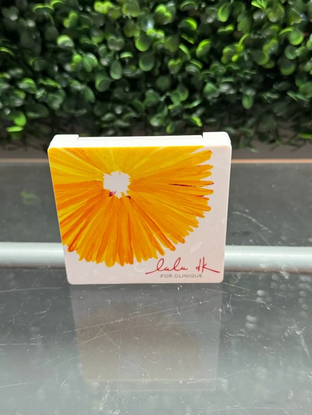 Clinique Compact with Bright Yellow Floral Artwork